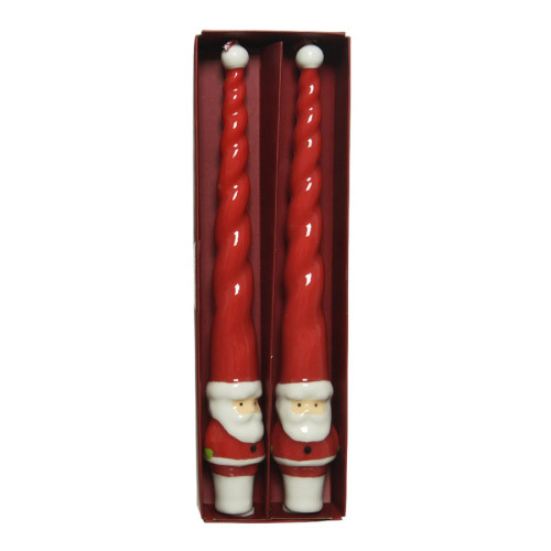 Candele natalizie di forma attorcigliata, di colore rosso e bianco, decorate con Babbo Natale